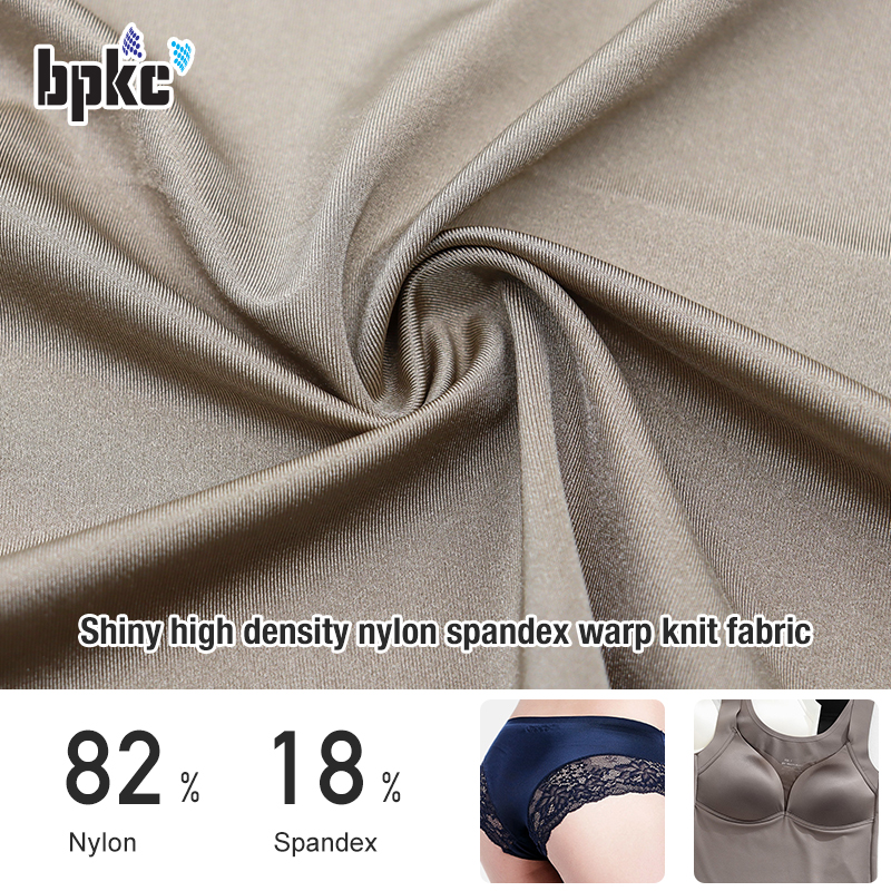 Shiny high density and high stretch nylon spandex warp knit fabric